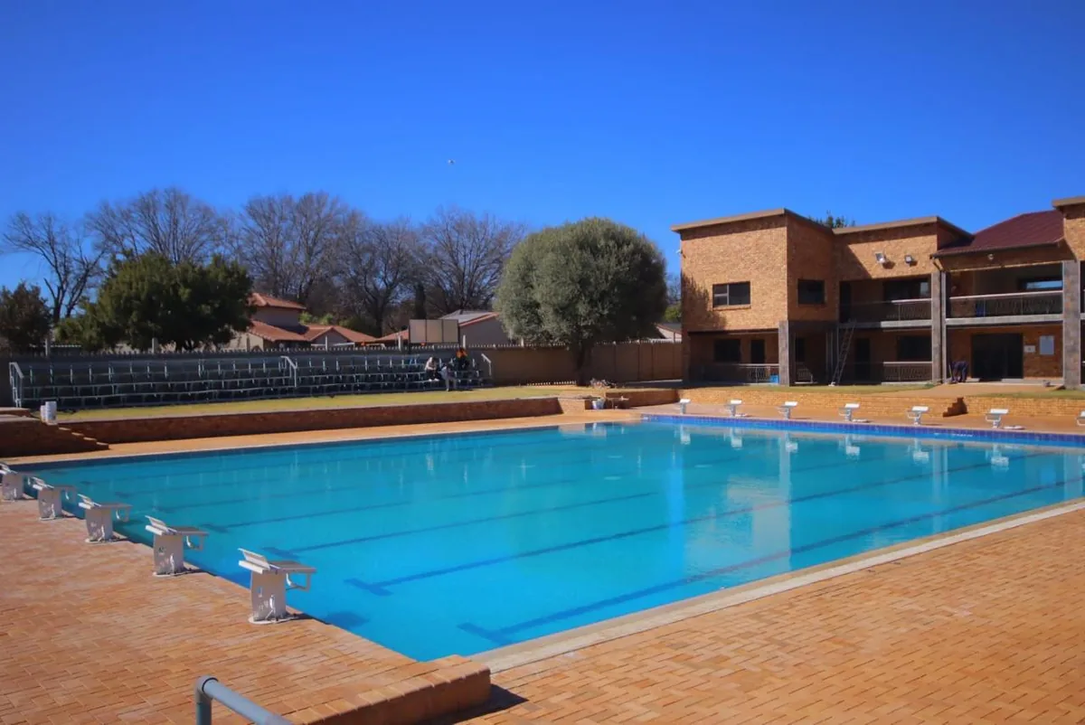 After: the same pool from above, filled and finished in blue
