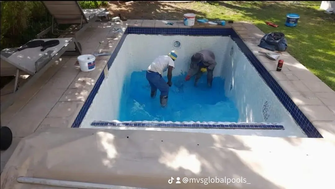 Before: team applying blue Marbelite to a freeform pool